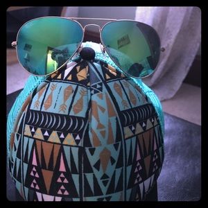 Patagonia trucker hat and ray ban aviators.